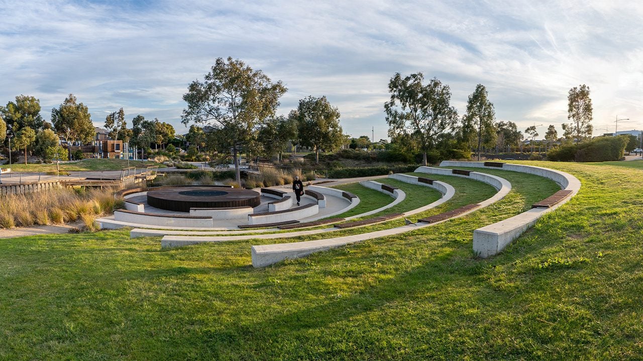 Svg+xml;charset=utf — tract Outdoor ampitheatre style seating made of concrete and timber set into a grassy hill