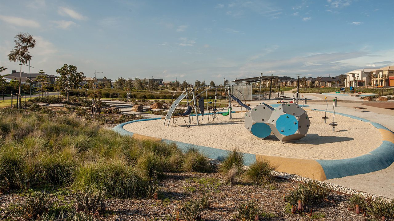 Svg+xml;charset=utf — tract Playground with silver, blue and grey play equipment in a sandpit