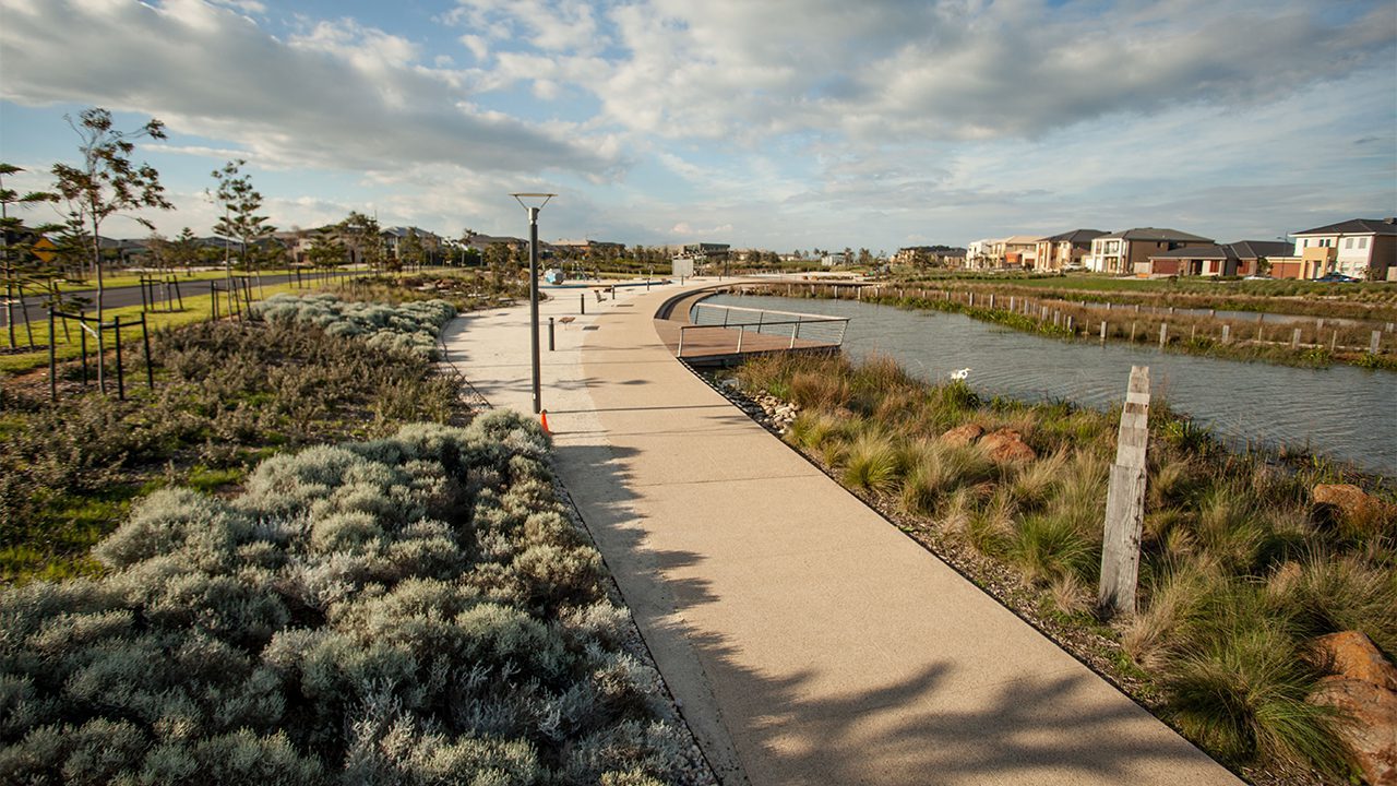 Svg+xml;charset=utf — tract Concrete path around a wetland surrounded by native plants