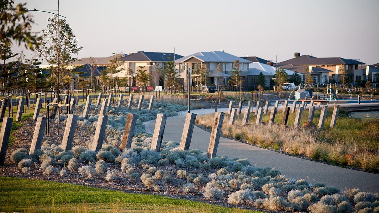 Svg+xml;charset=utf — tract Winding path leading to playground surrounded by native planting and wooden bollards